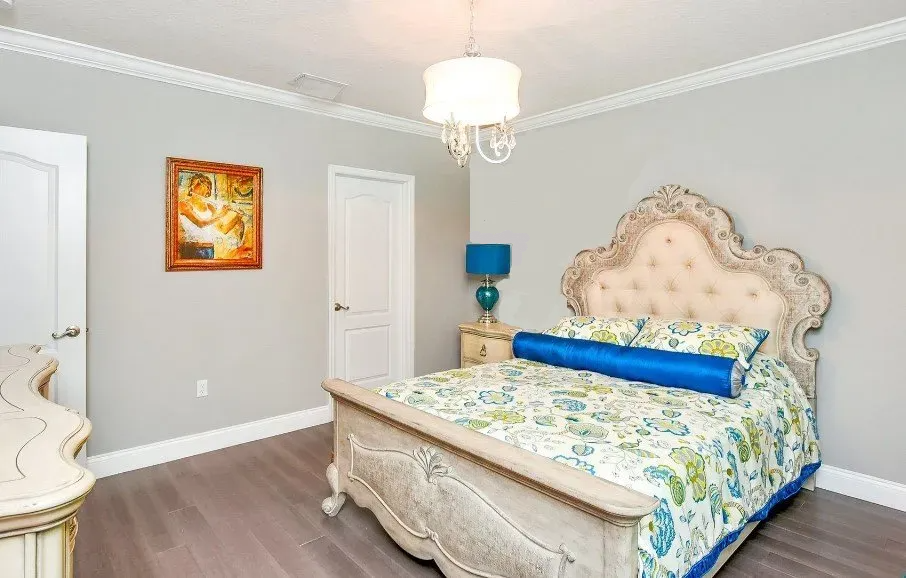 Island style bedroom in cool grays with turquoise.