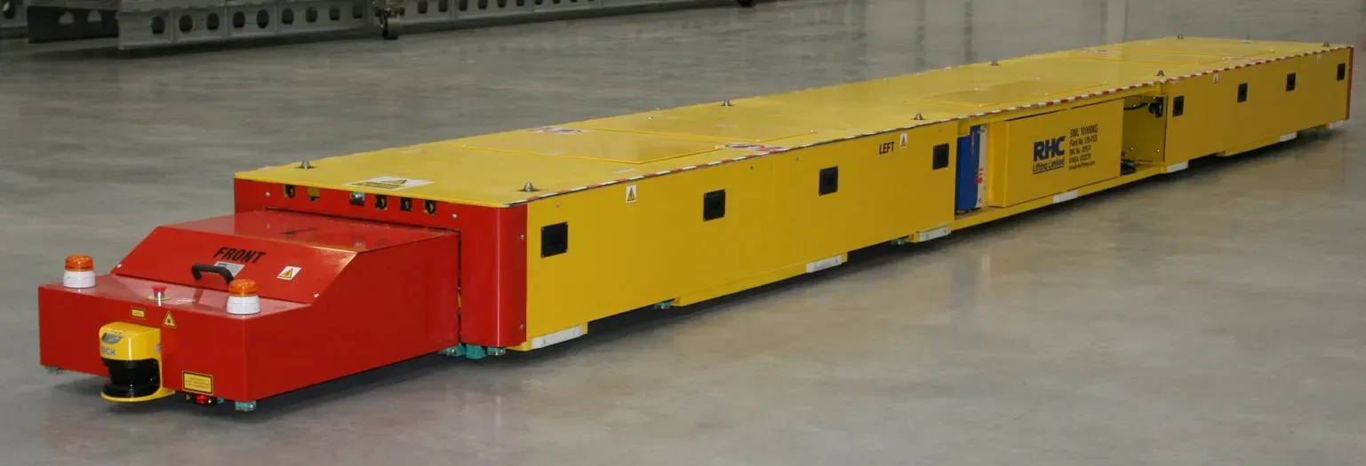 Automated guided vehicle (AGV) travelling across the floor