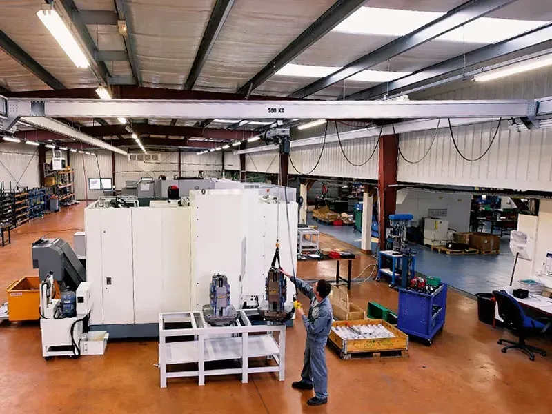 Aluminium light crane being worked on by an engineer at an RHC workshop