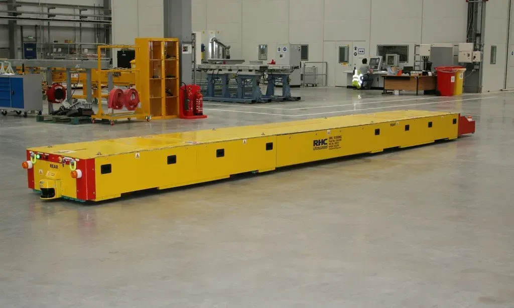 An automated guided vehicle shown moving across the floor