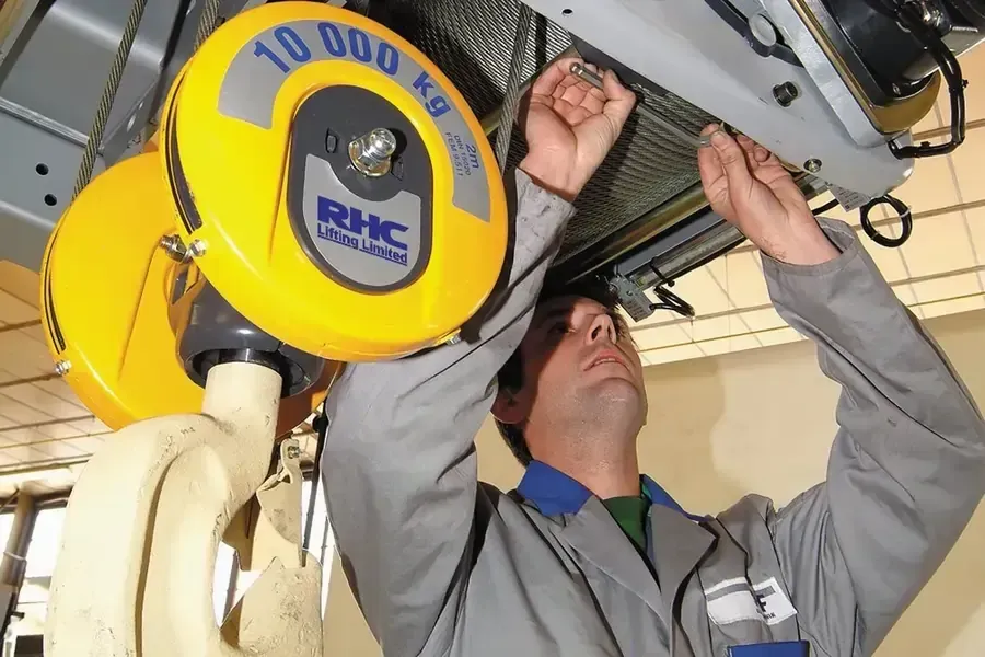 An engineering inspecting a 10t hoist