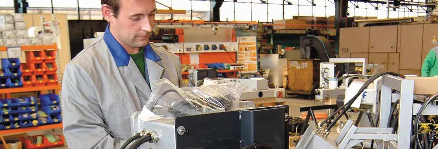 An RHC engineer working on a repair in the workshop