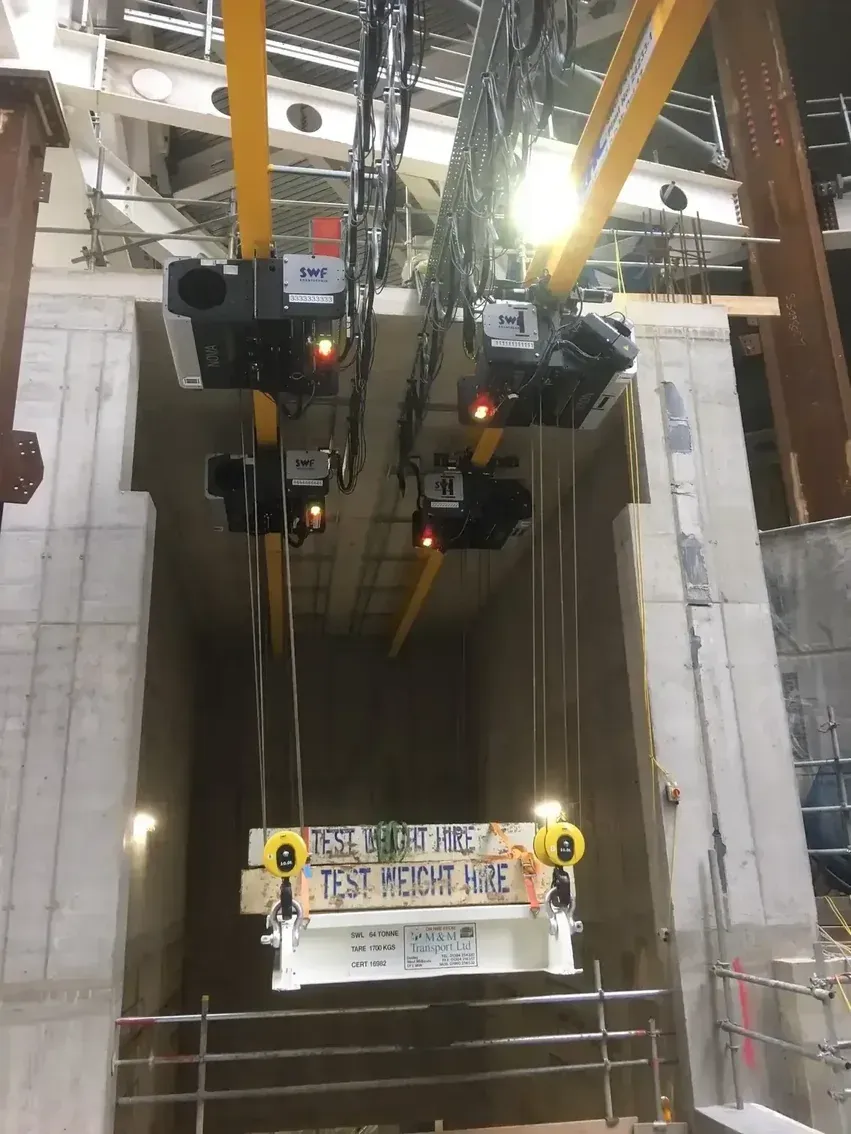 A gantry beam being load tested using test weights
