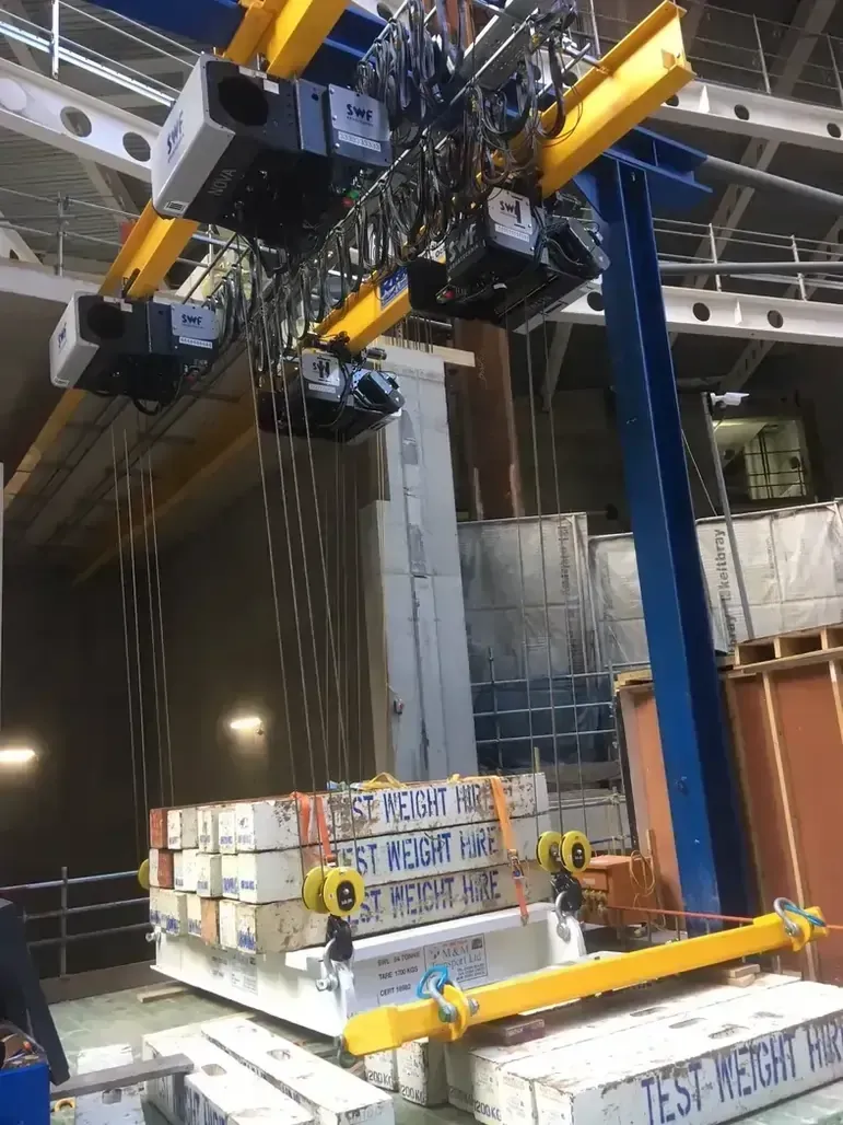 A gantry beam being load tested using test weights
