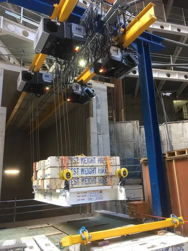 A gantry beam being load tested using test weights