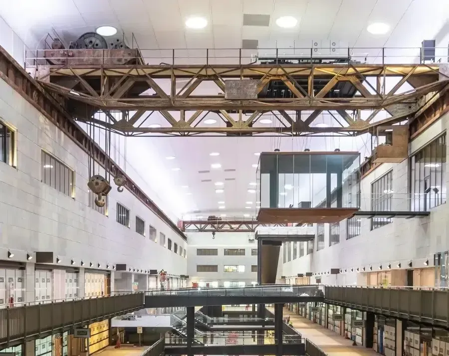 Inside the newly refurbished Battersea Power Station, focusing on the refurbished crane & glass box