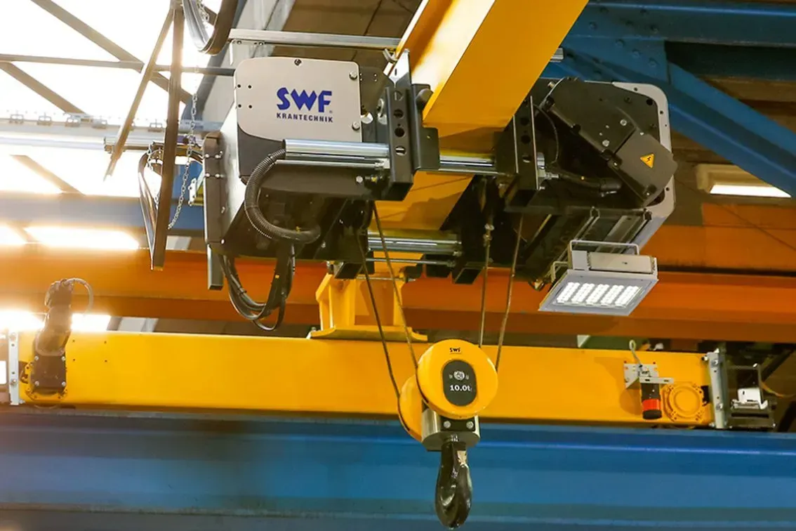 An electric wire rope hoist in action