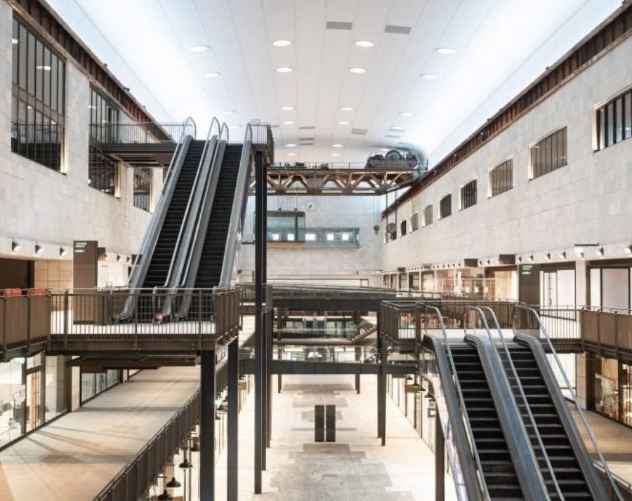A photo of turbine hall B in Battersea Power Station, showing RHC's bandstand box suspended in the distance
