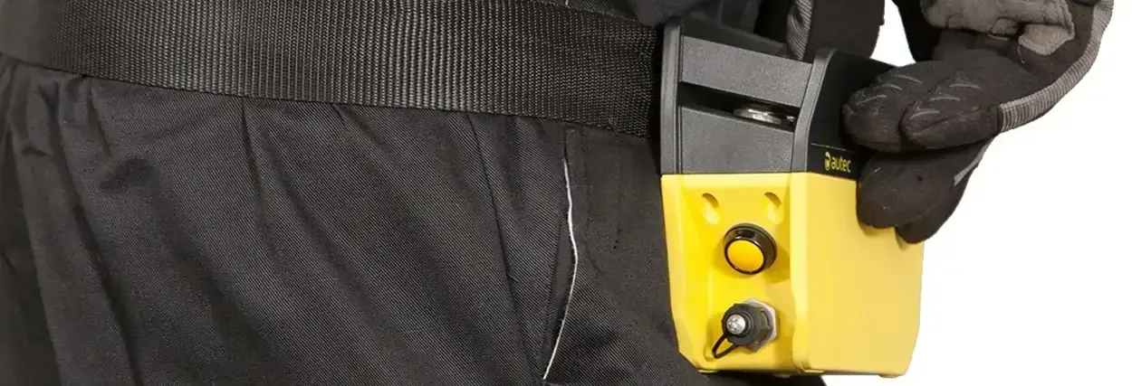 Remote being used with a waist strap holder