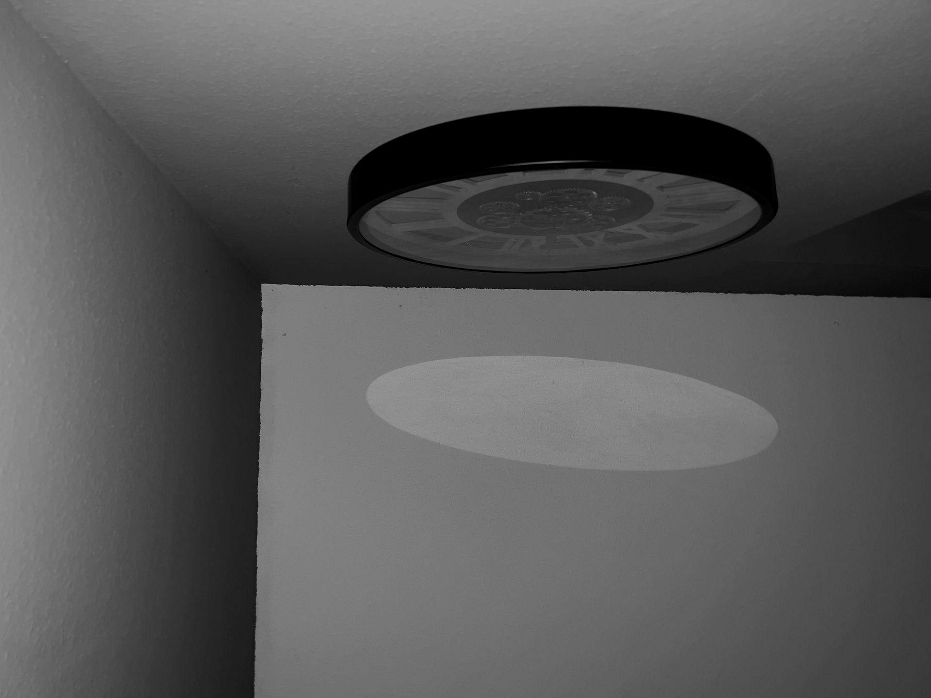 A circle of light on the wall — a reminder of how fleeting moments leave their trace.