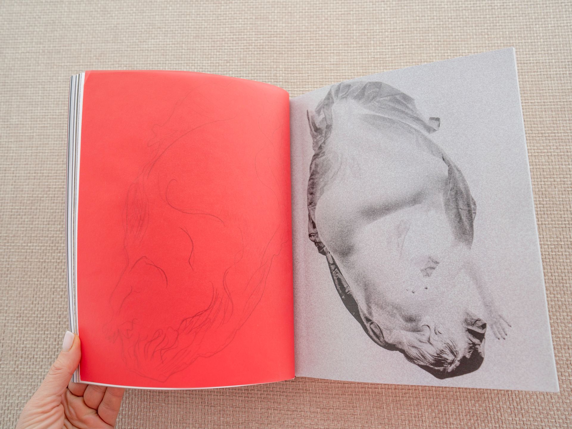 Photobook self-portrait with red tracing paper and hand-drawn body outline overlay.