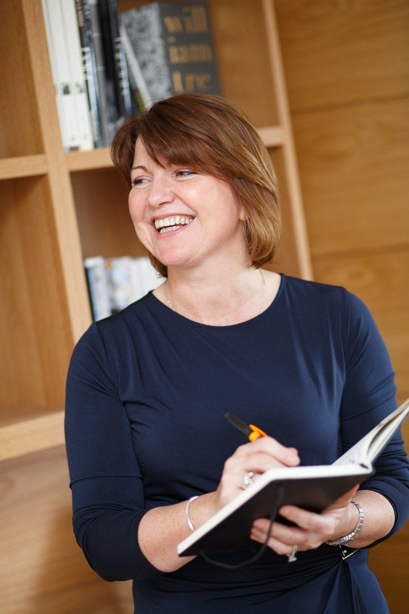 businesswoman with notebook and pen