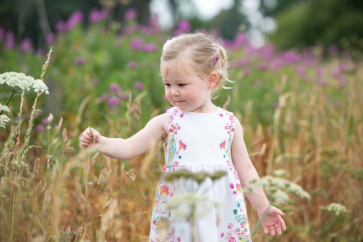 little girl in long grass