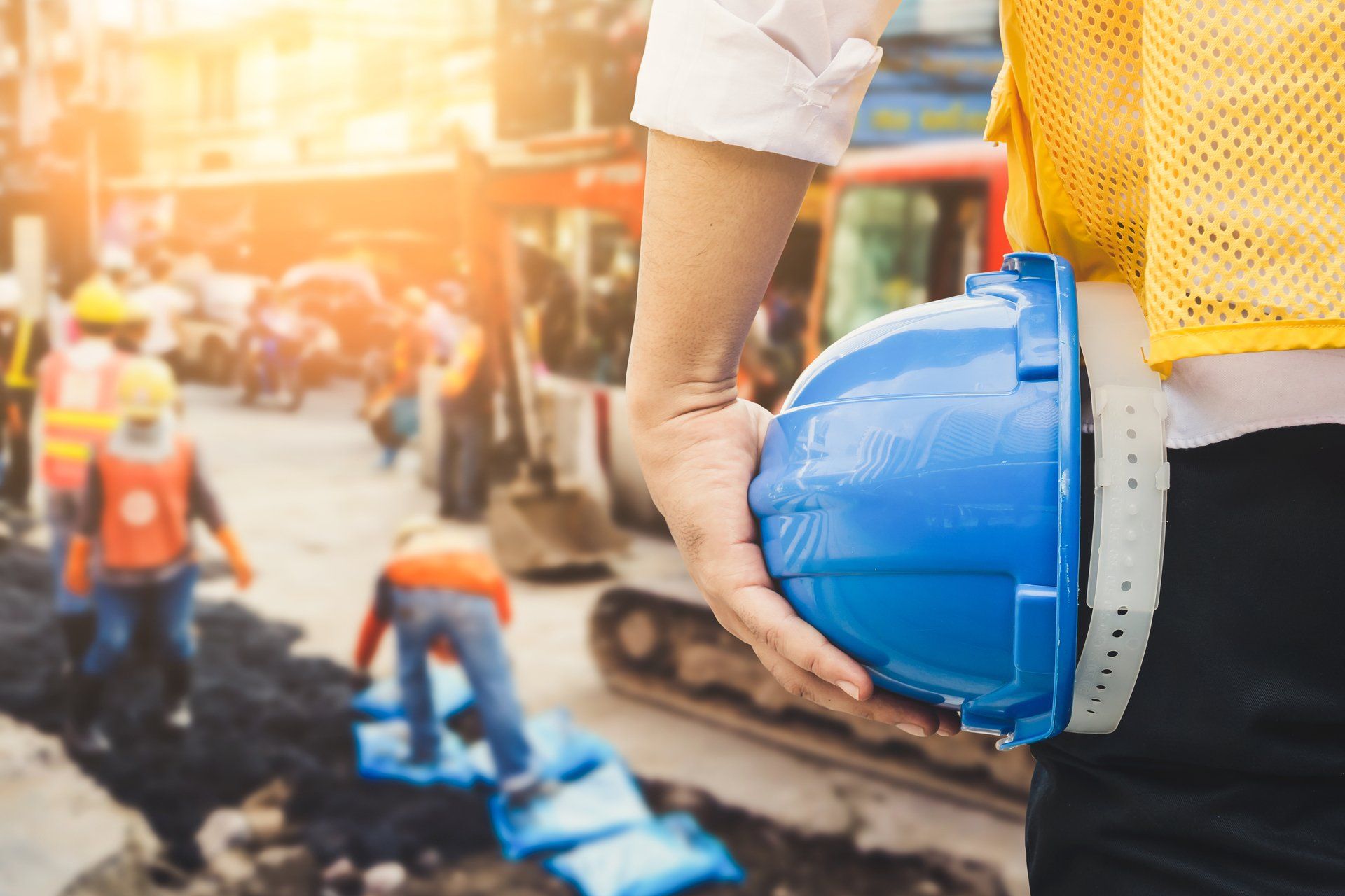 worker carrying a hard hat