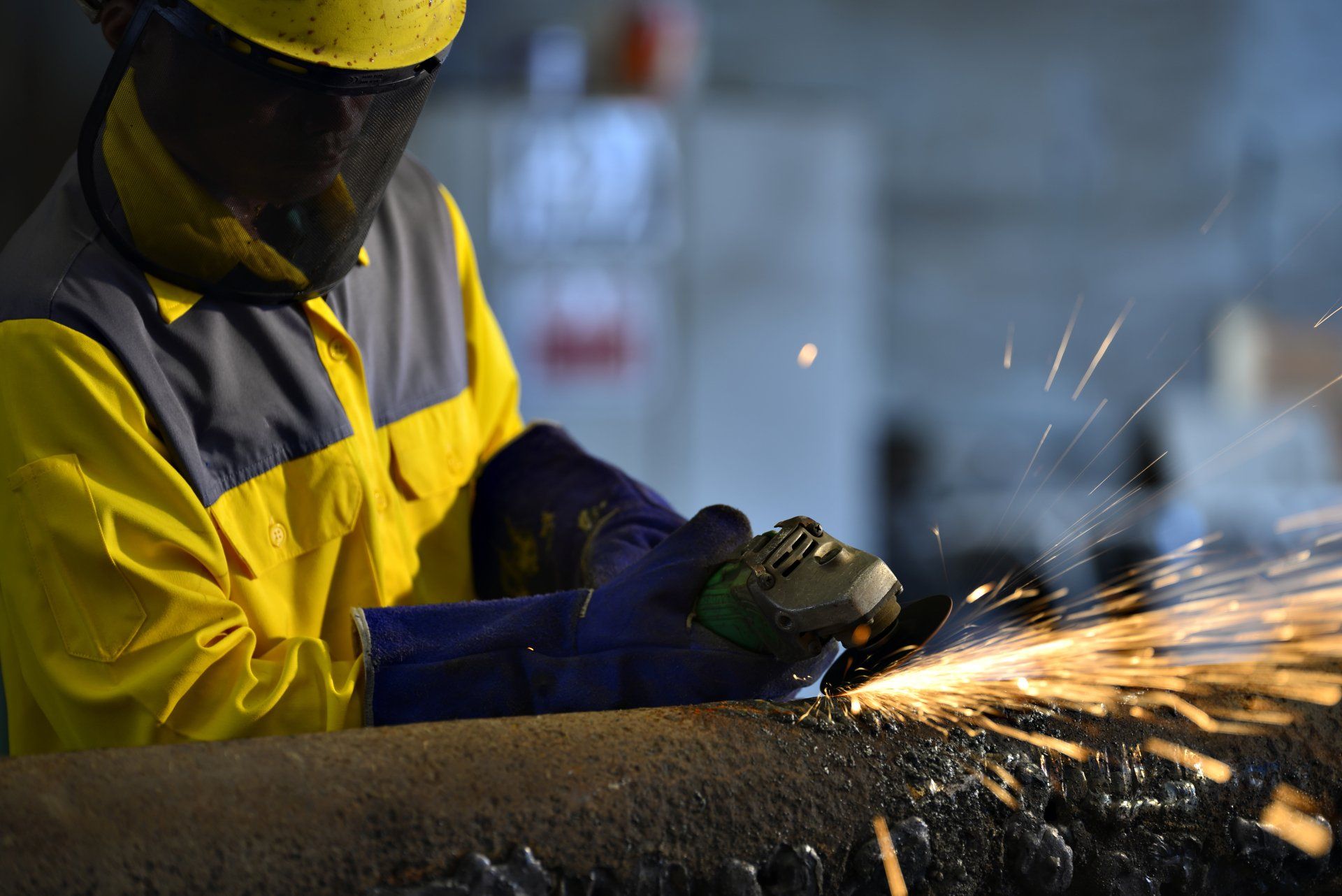 worker carrying a hard hat