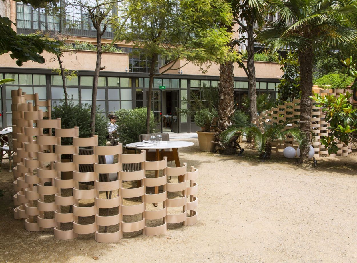 Arhci.cotto used outside to make a nice seating area in a restaurant