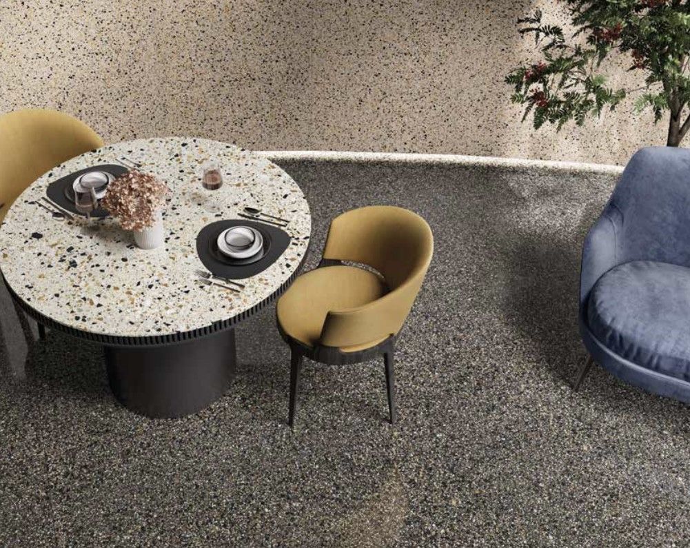 terrazzo tiles , a round coffee table with a yellow chair