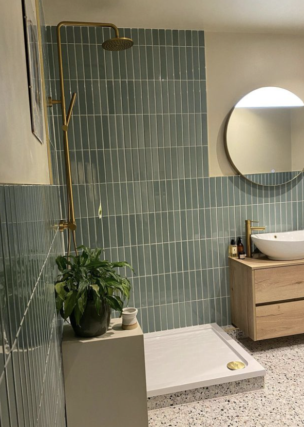 Close up of bathroom wall tiles flaut green and sik and draws