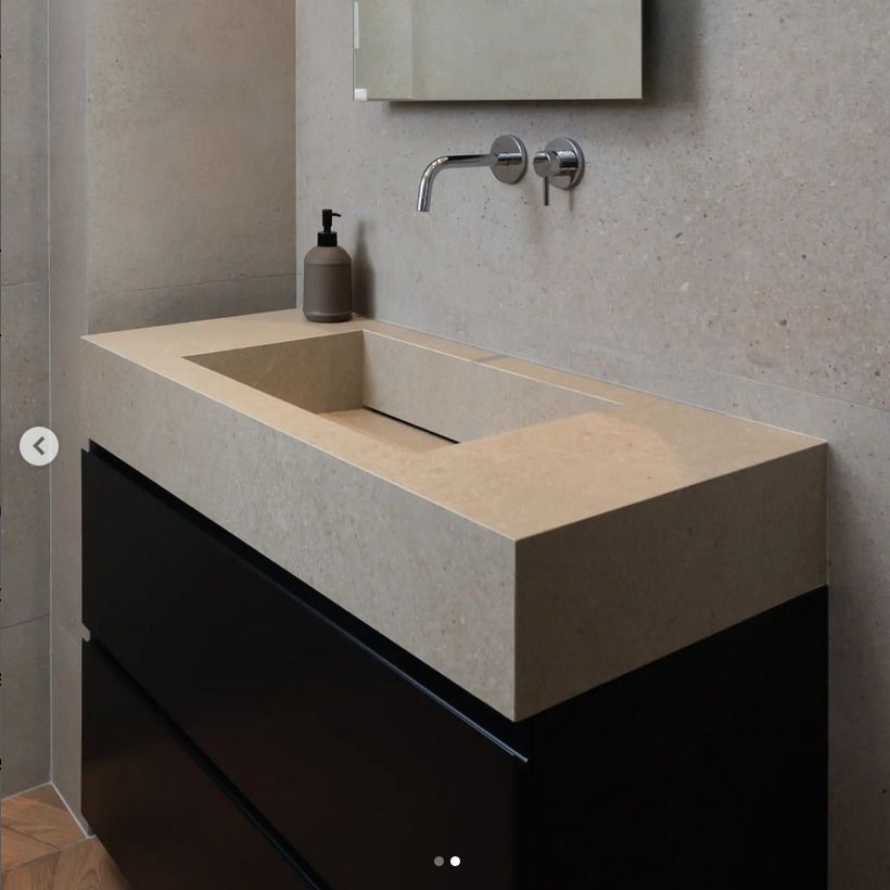 Bespoke ivory concrete effect sink in a modern bathroom
