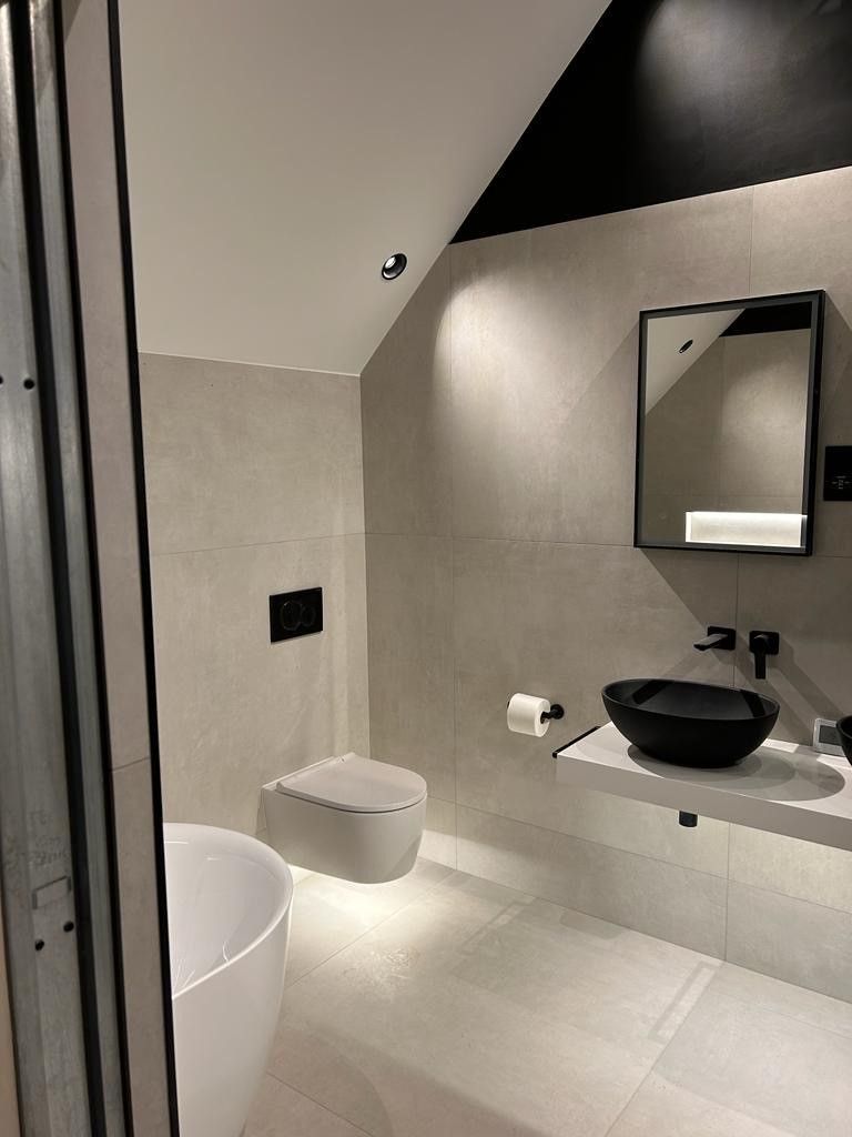 A local project that used concrete effect tiles on the wall