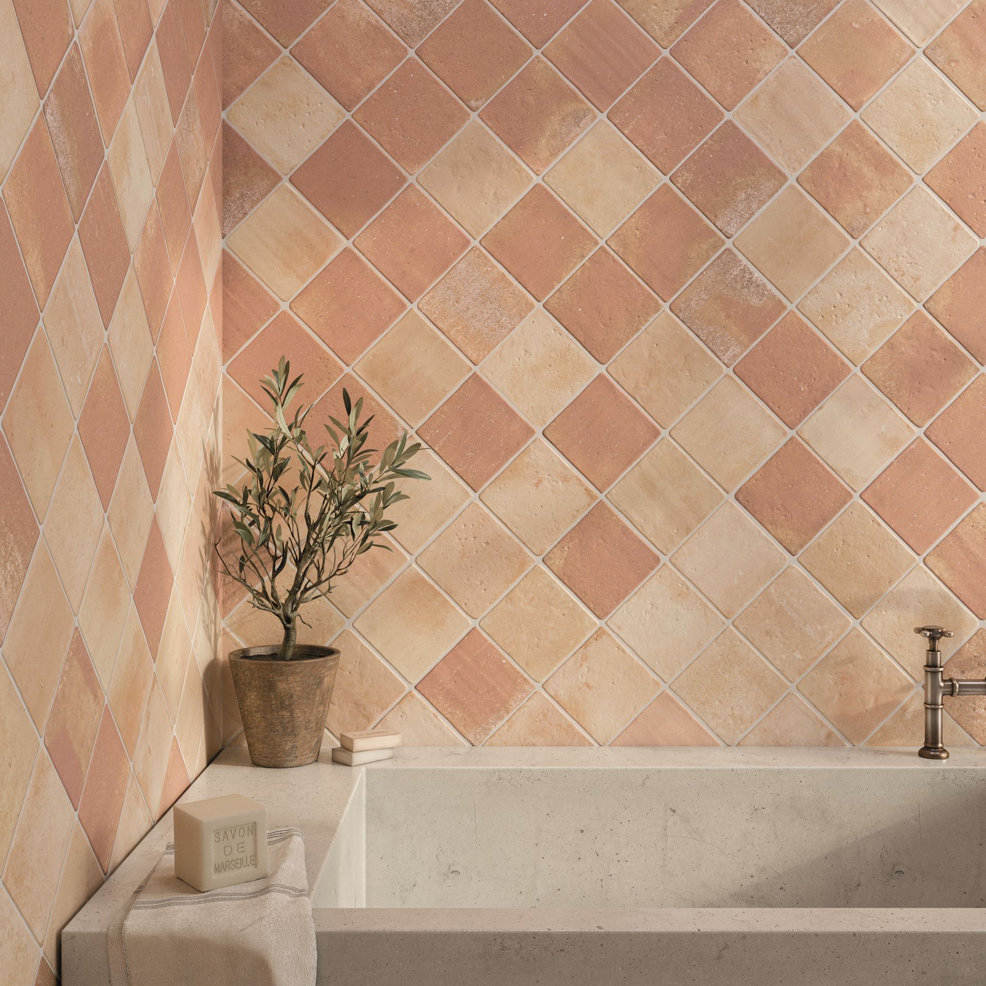 terracotta tile used in a bathroom set up with a silver like brass