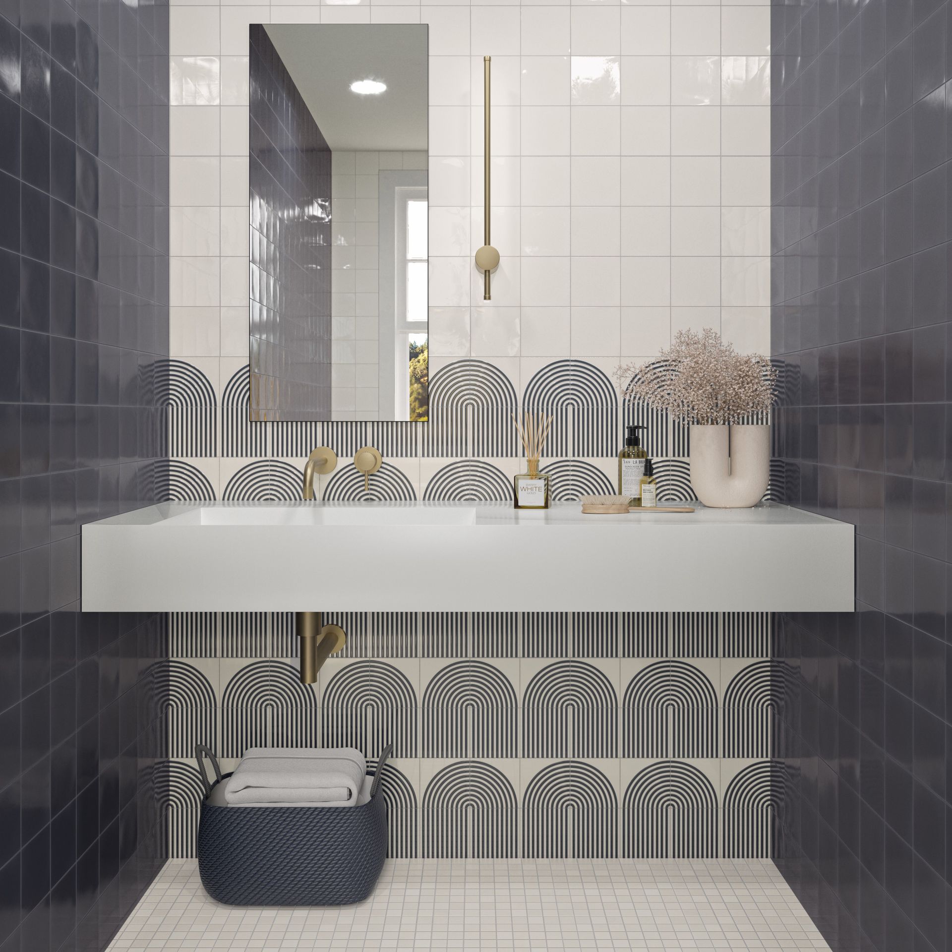 a curved décor tiles with a gold brass sink and a long rectangular mirror 