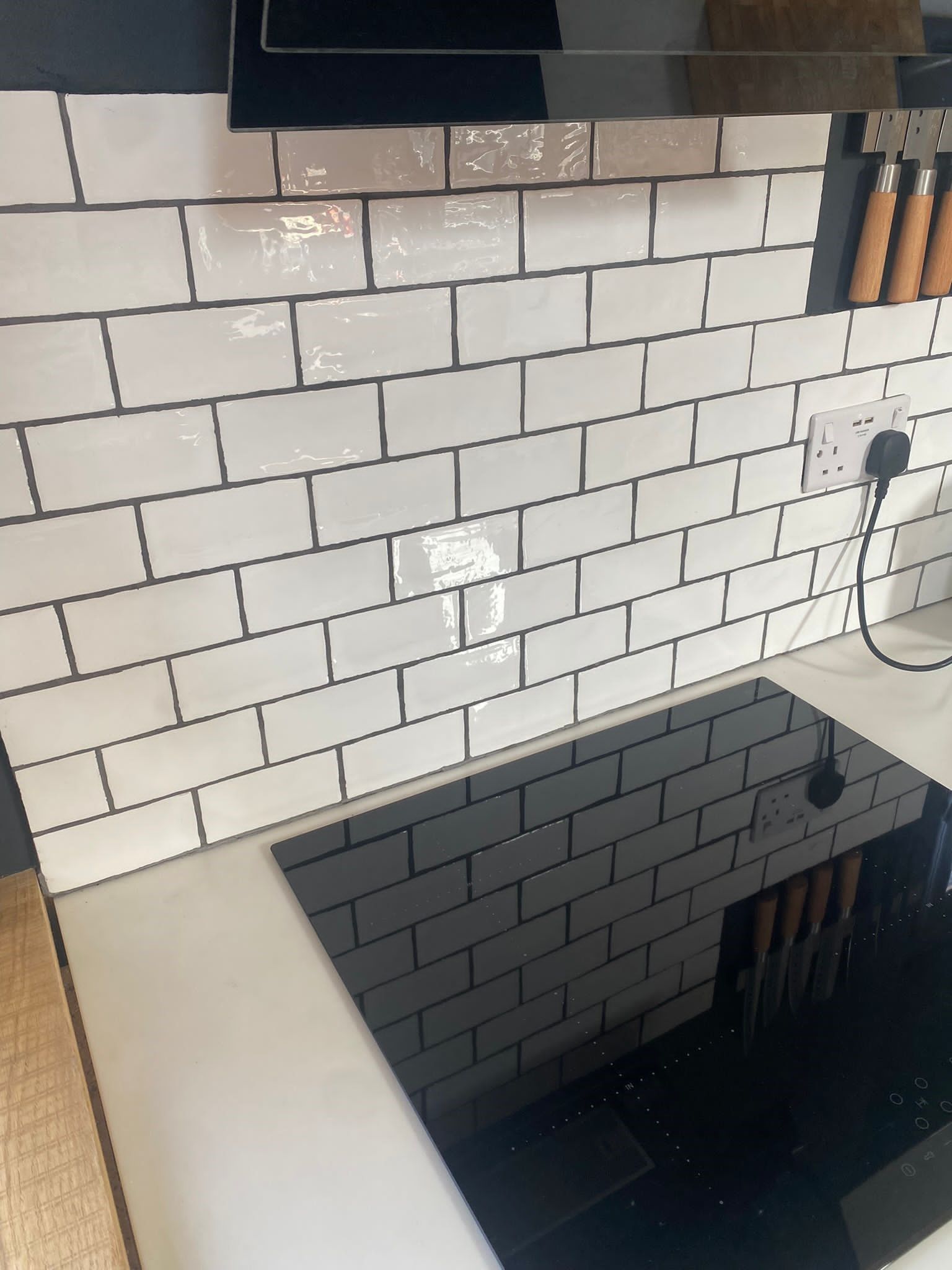 Farmhouse blanco gloss tiles used on the wall of this kitchen for a splashback look