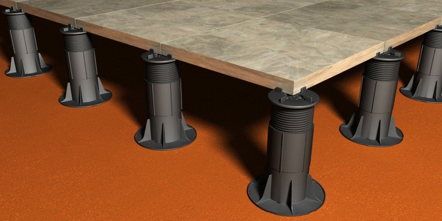 Fixed head adjustable pedestals shown in action with a tile they are holding