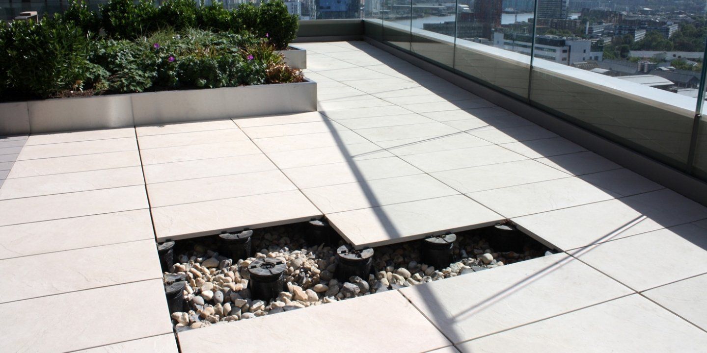 an example image of what fixed head adjustable pedestals look like laid with tiles