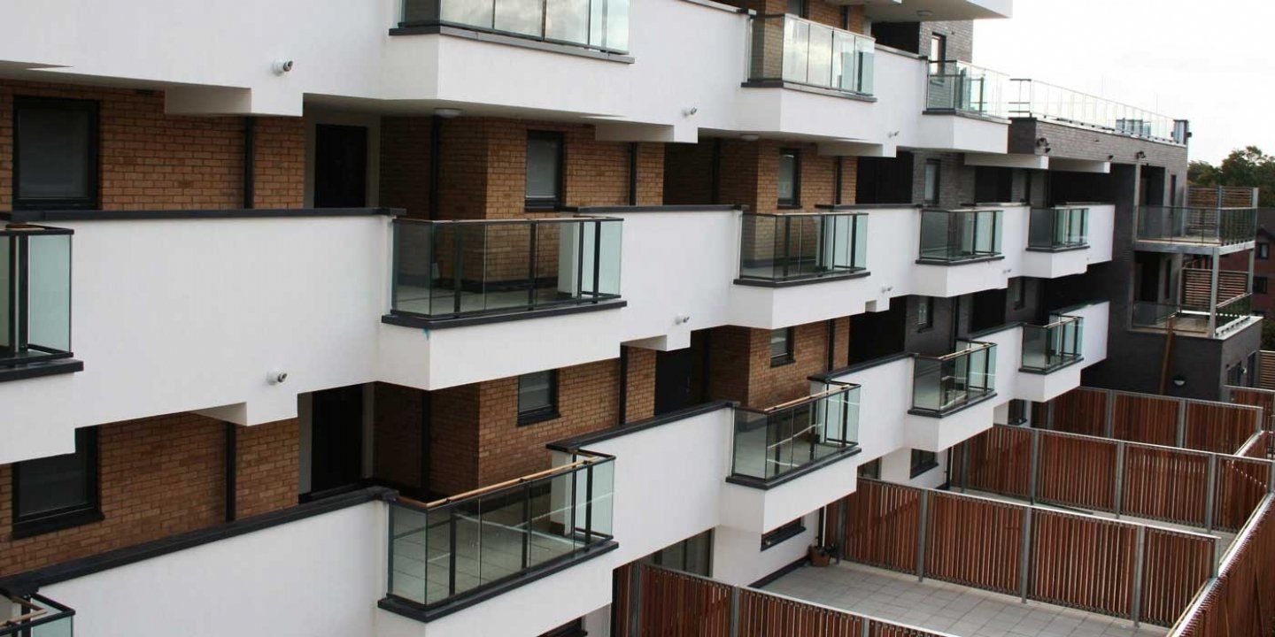 apartment buildings with white and wood