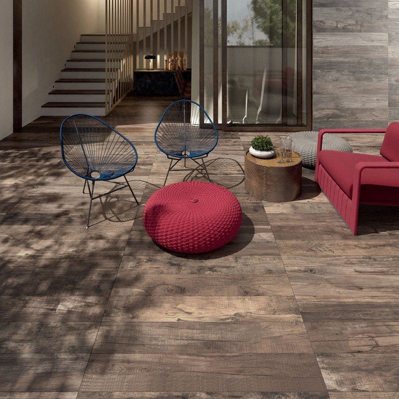 wooden effect patio tiles and a red couch