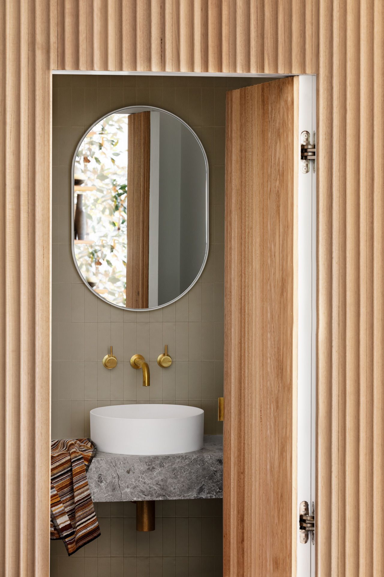 Candy flat wall tiles used on the wall of this modern bathroom