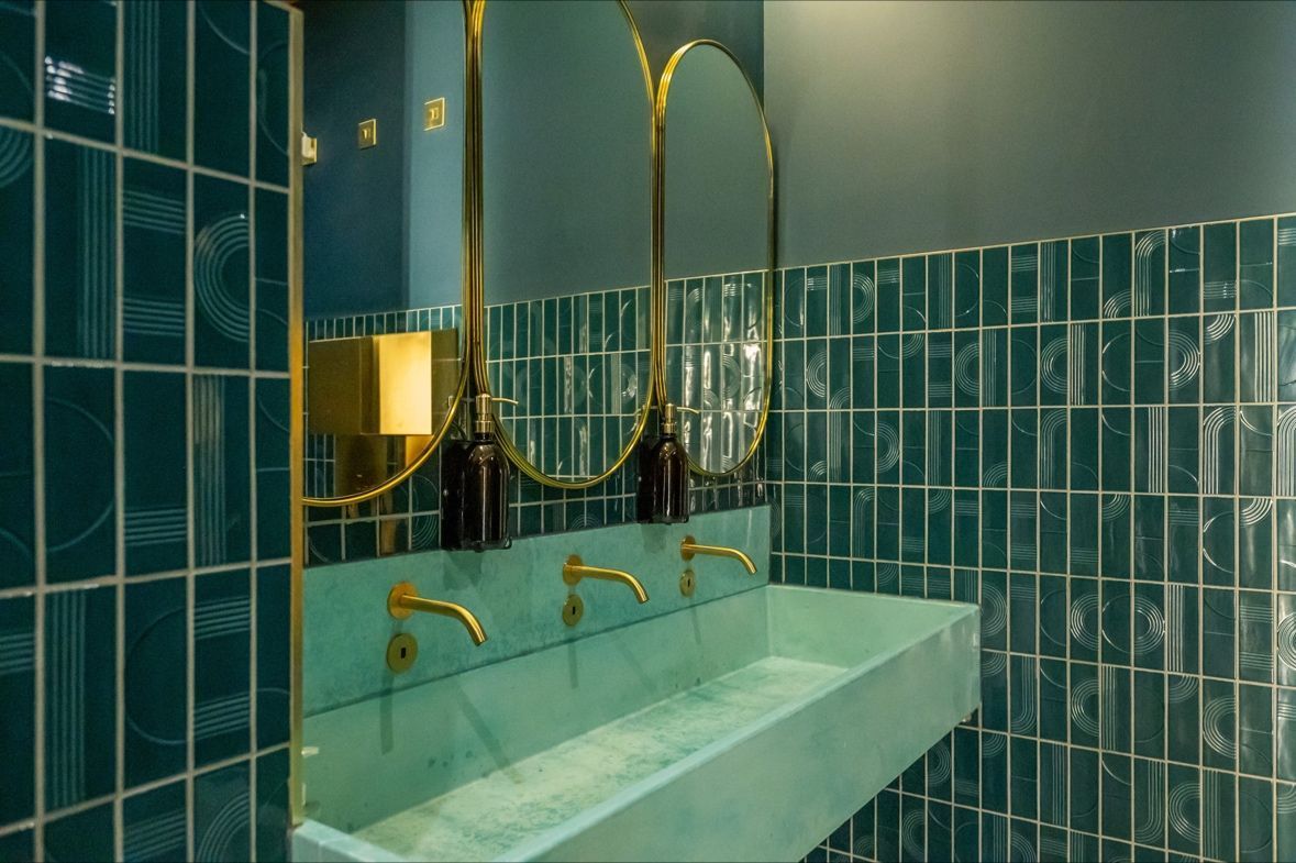 phenoix green pattern with soap and body wash infront of it