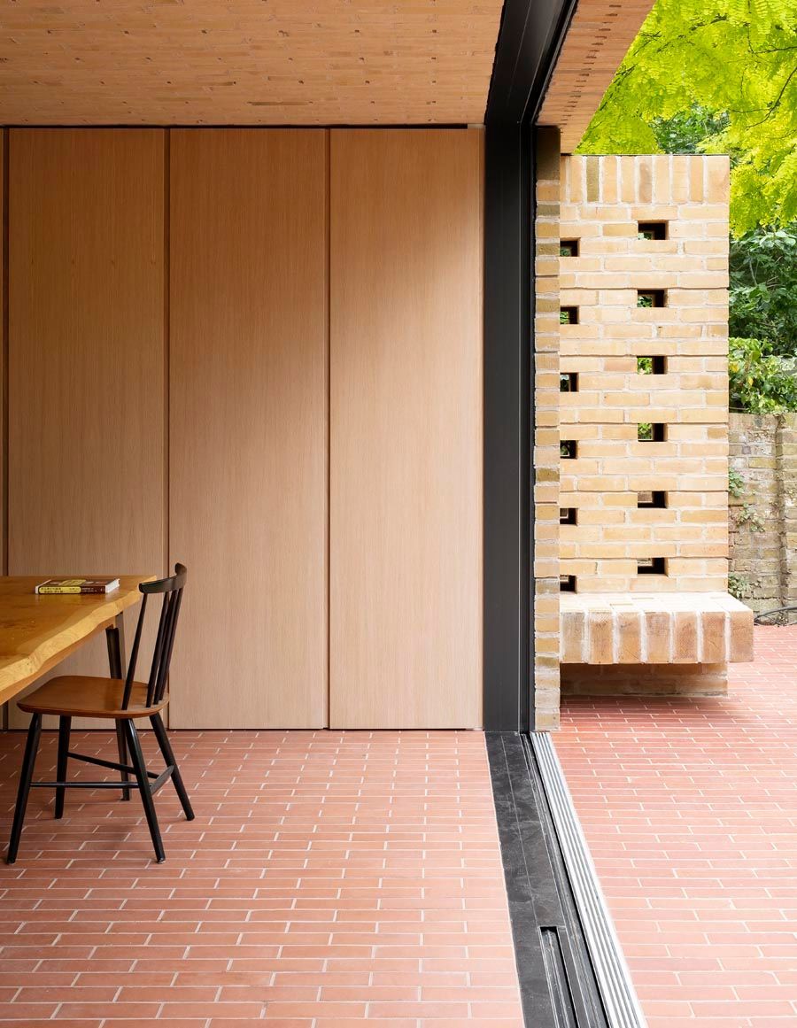 Picture of a table and cupboards next to outside door