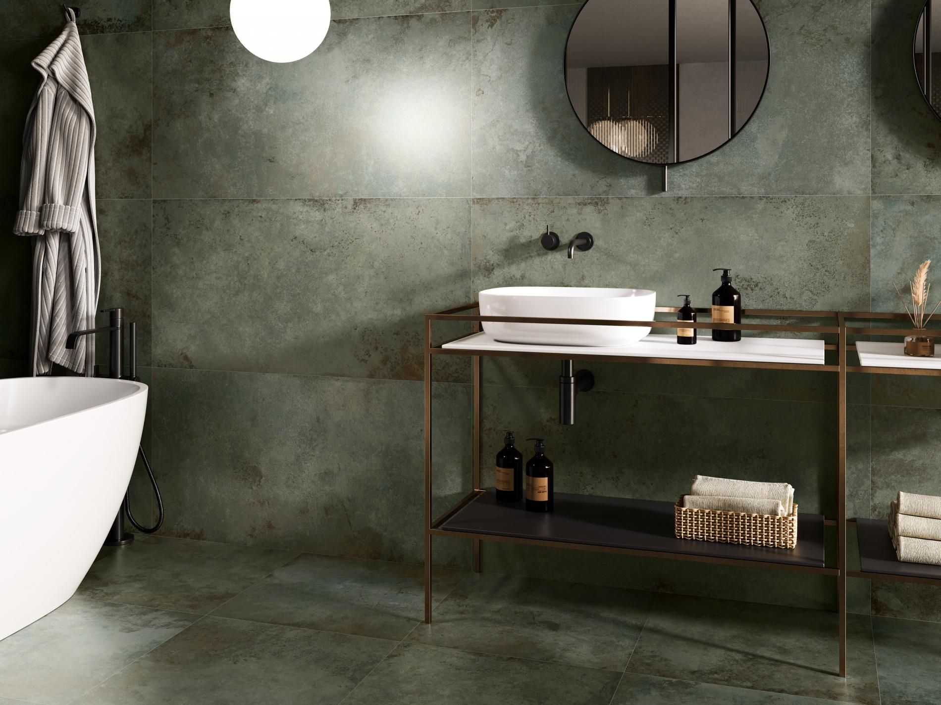 Metaliic green floor and wall tiles used in a bathroom with sink and taps
