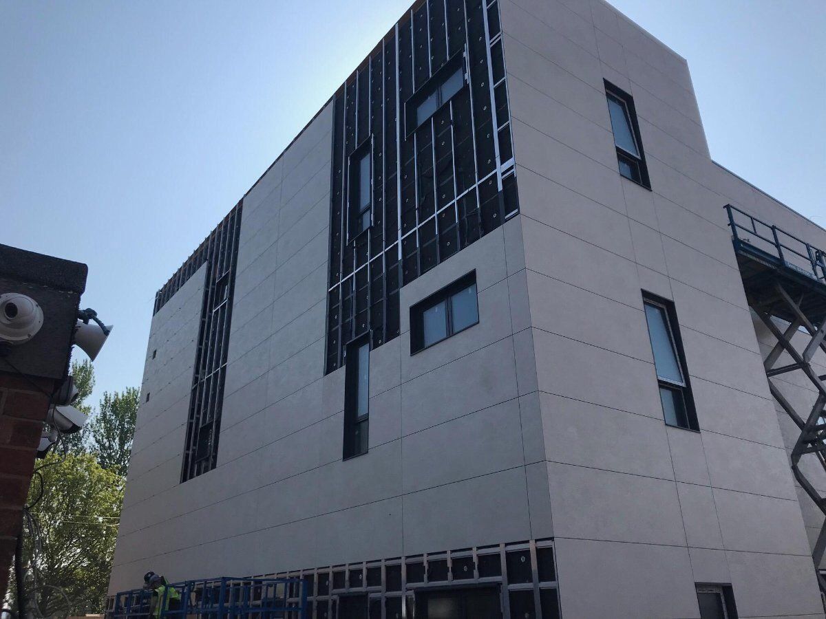 tall white building with lots of windows