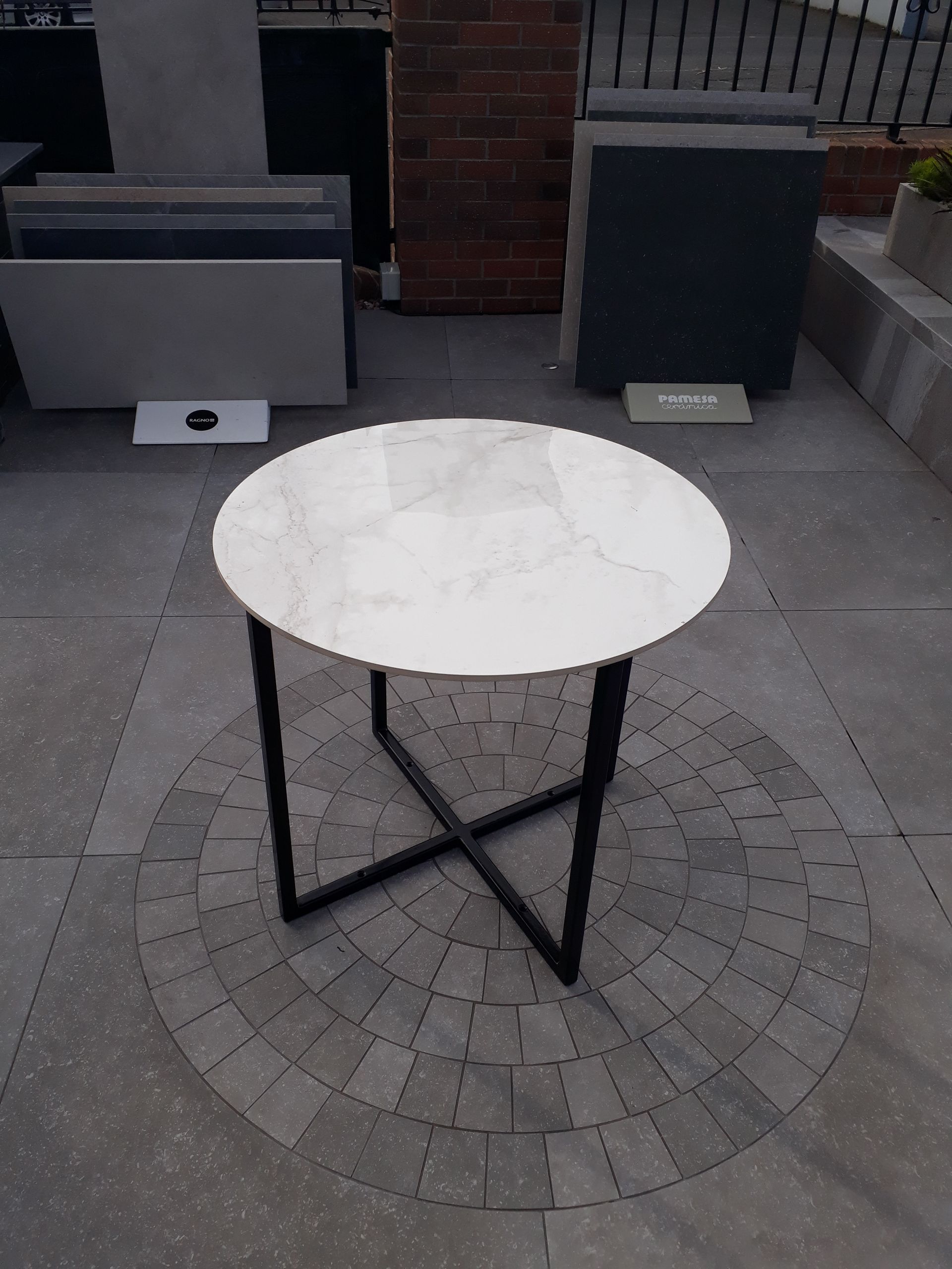 Bespoke white marble table shown off in a show room