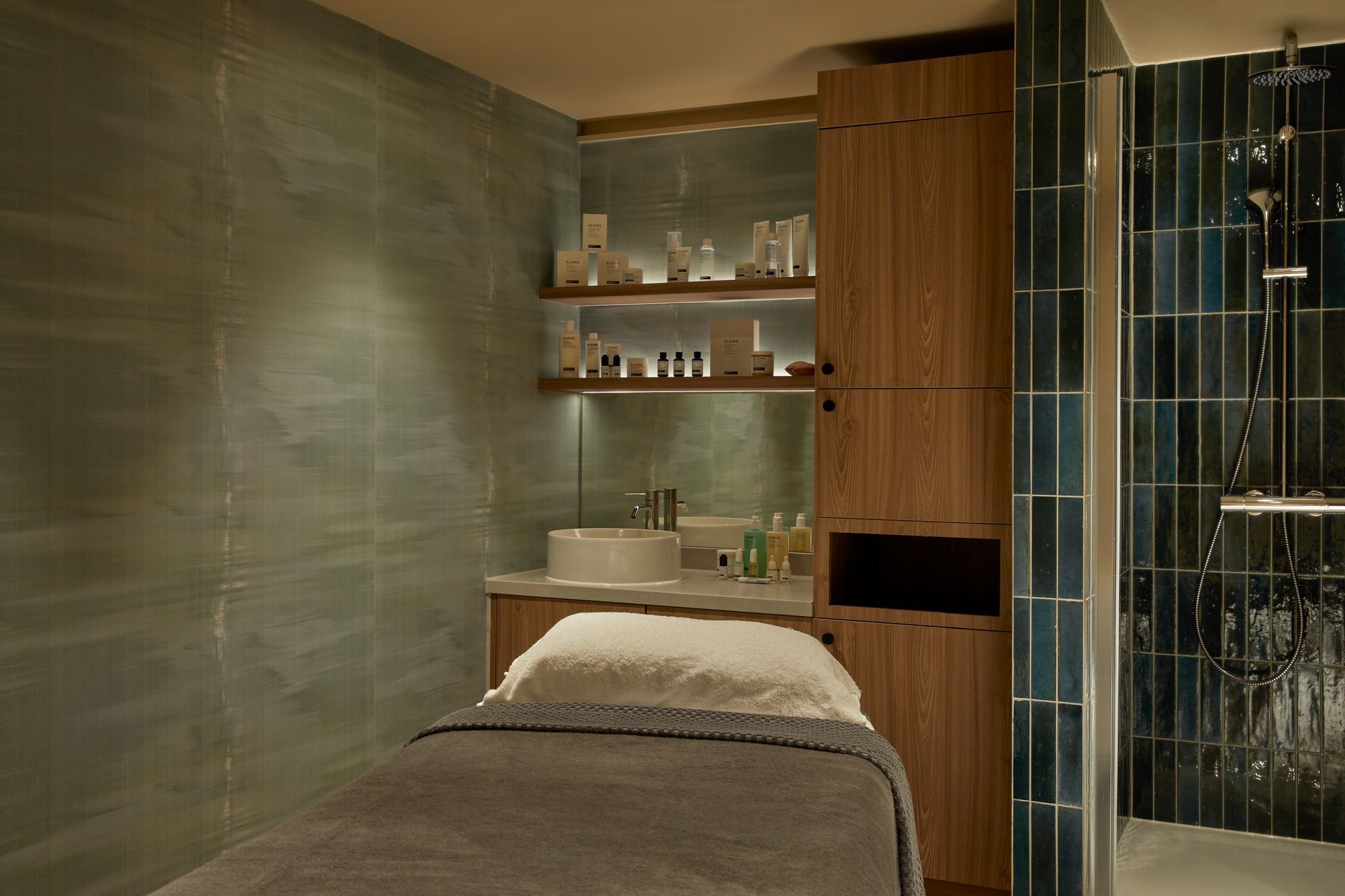 green and blue wall tiles in massage room
