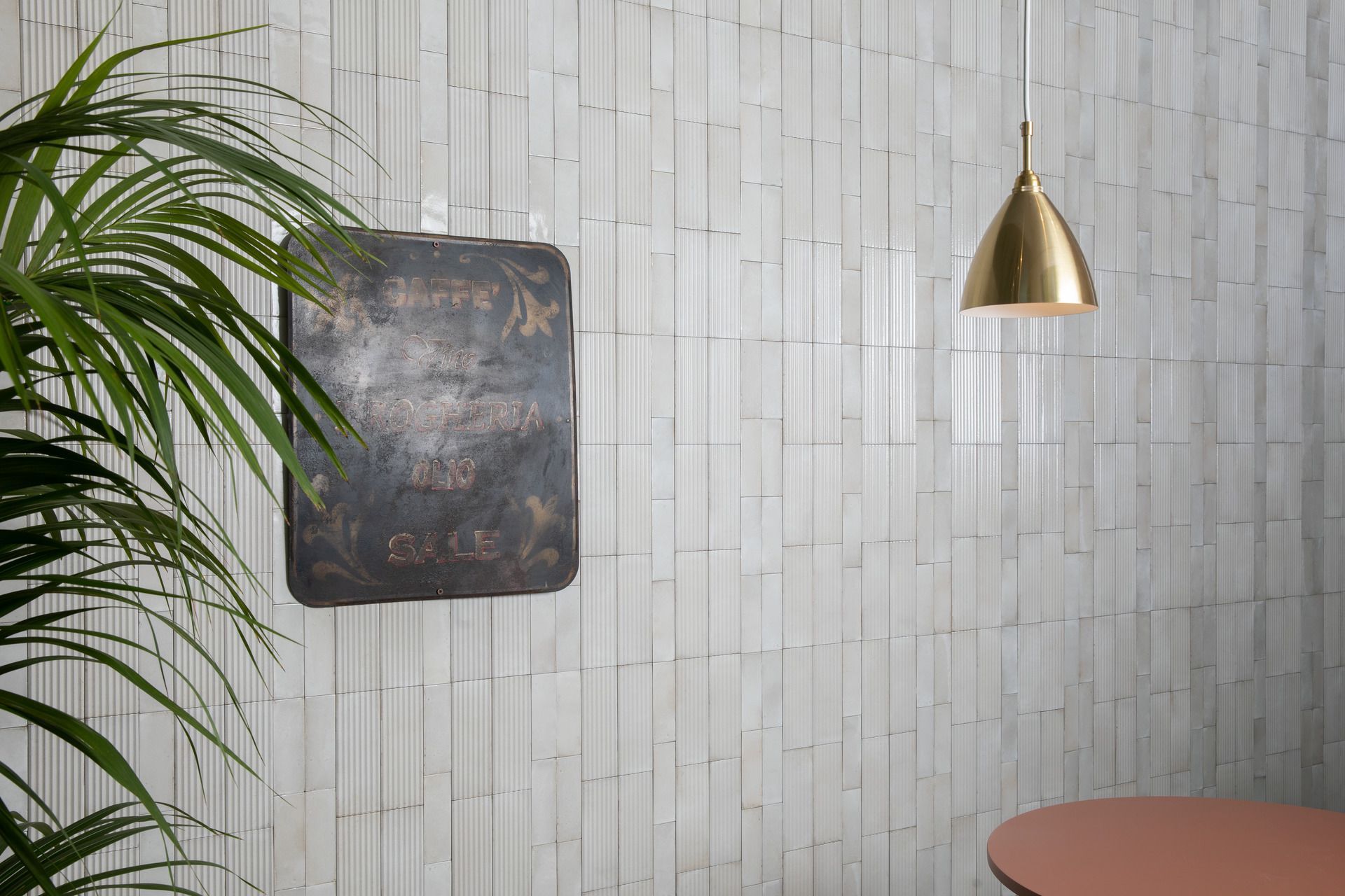 capri fluted on a feature wall with a golden dangling light