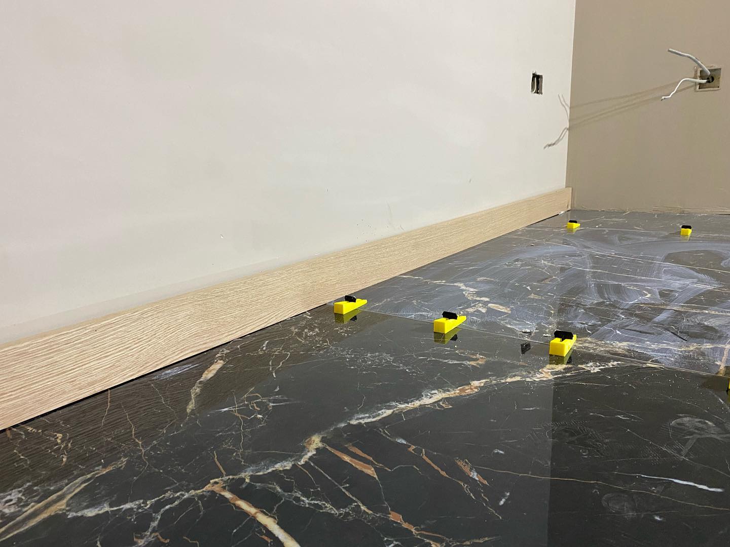 Black marble floor tile close up