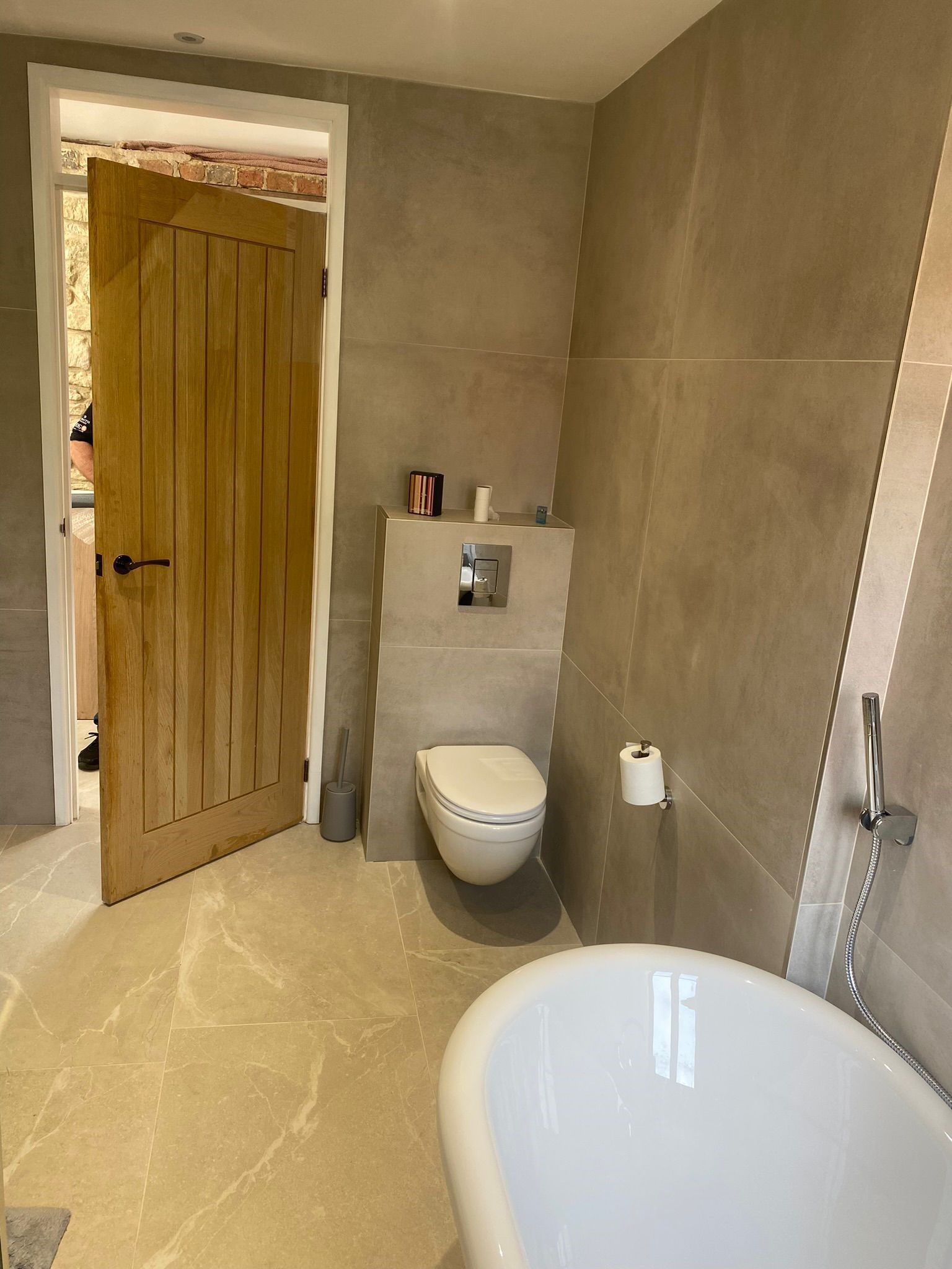 Athens 90x90 matt bathroom wall tiles used in a modern bathroom with marble floor effect tiles