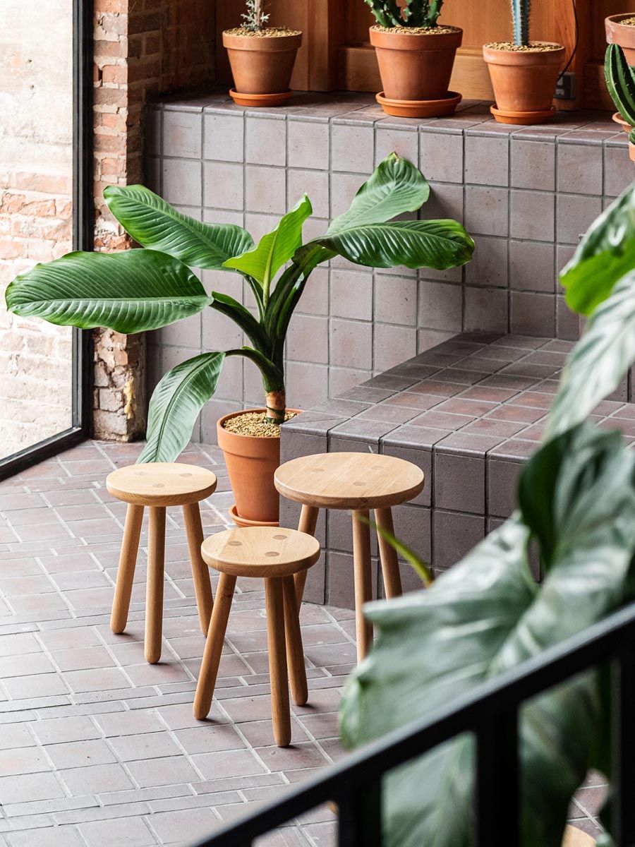 3 stools and archi.quarry tiles round them
