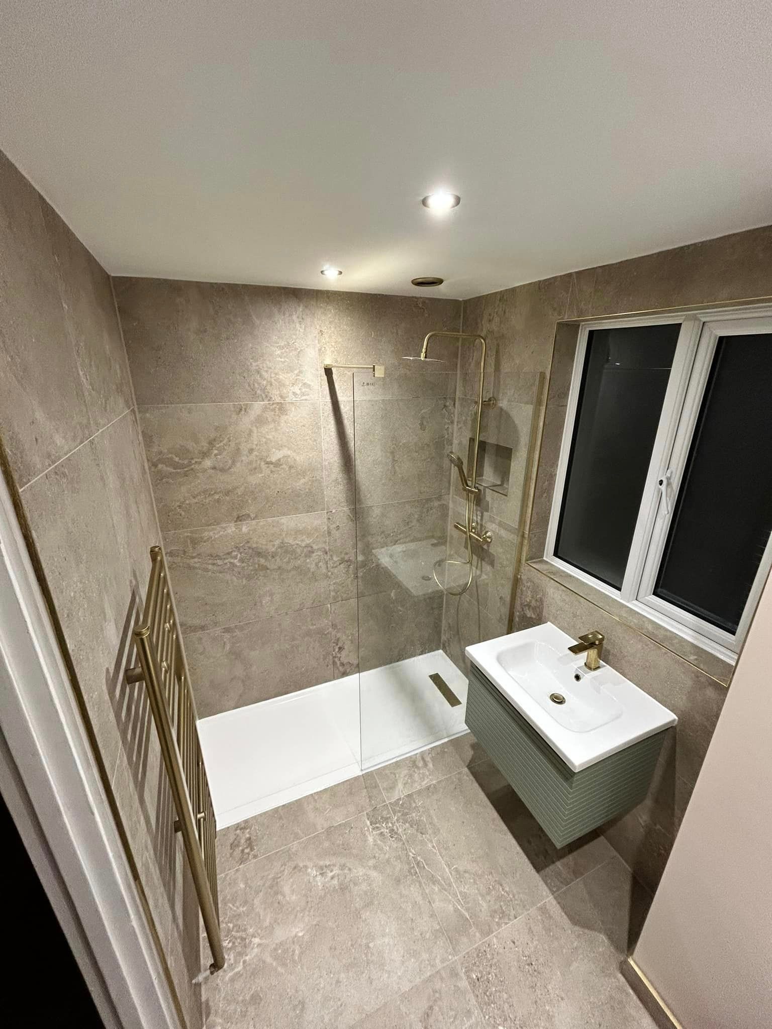 Limestone effect wall tiles used in a modern bathroom