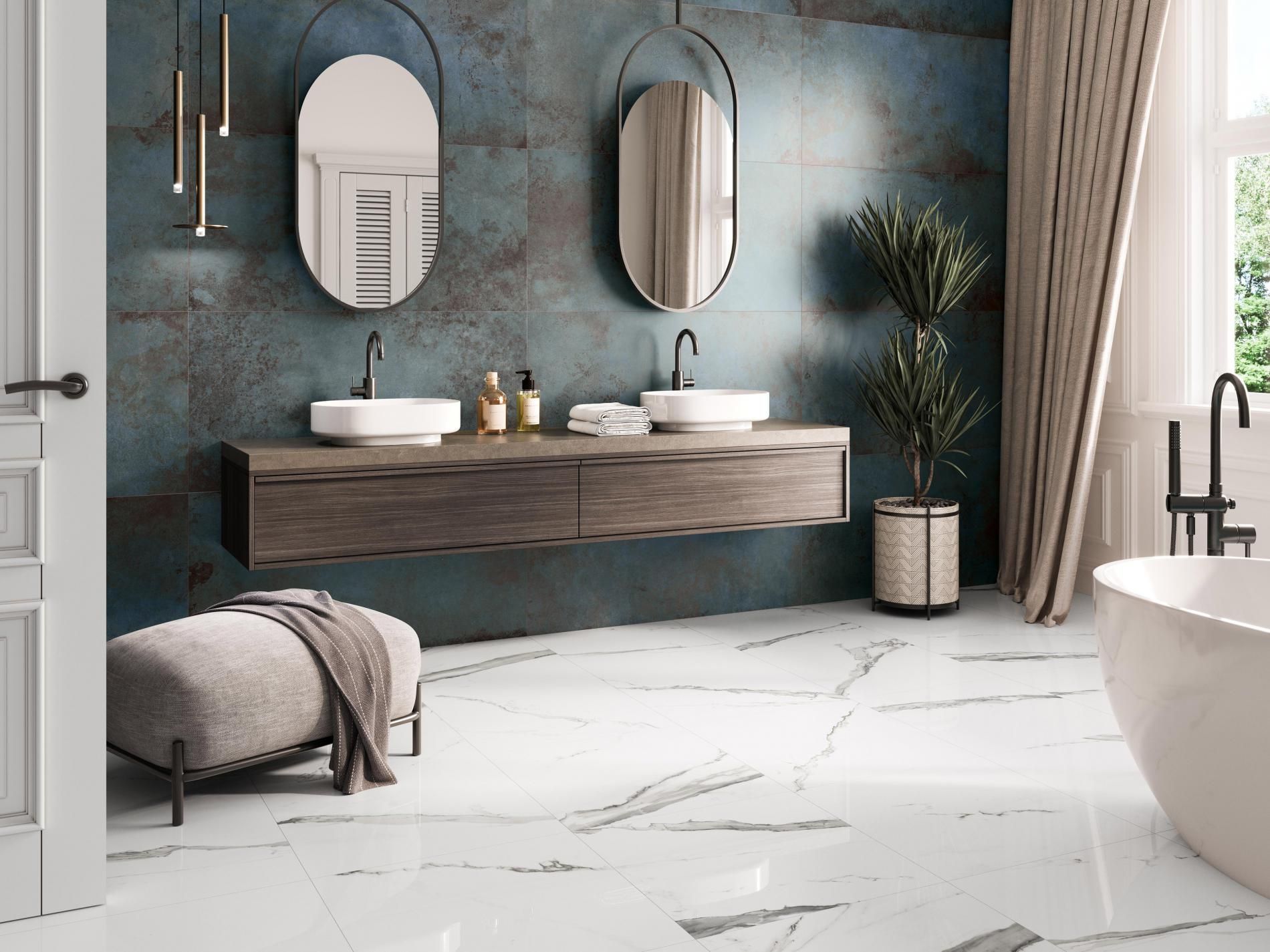 Metallic blue wall tiles used in a small bathroom featuring marble effect floor tile
