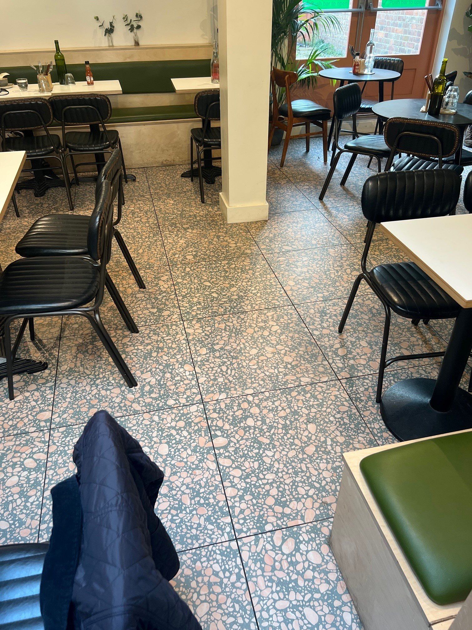 Terrazzo effect floor tiles used in a cafe