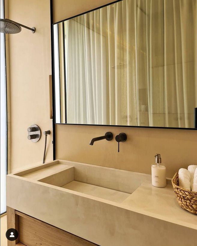 Bespoke Sink in a homes bathroom with black faucet