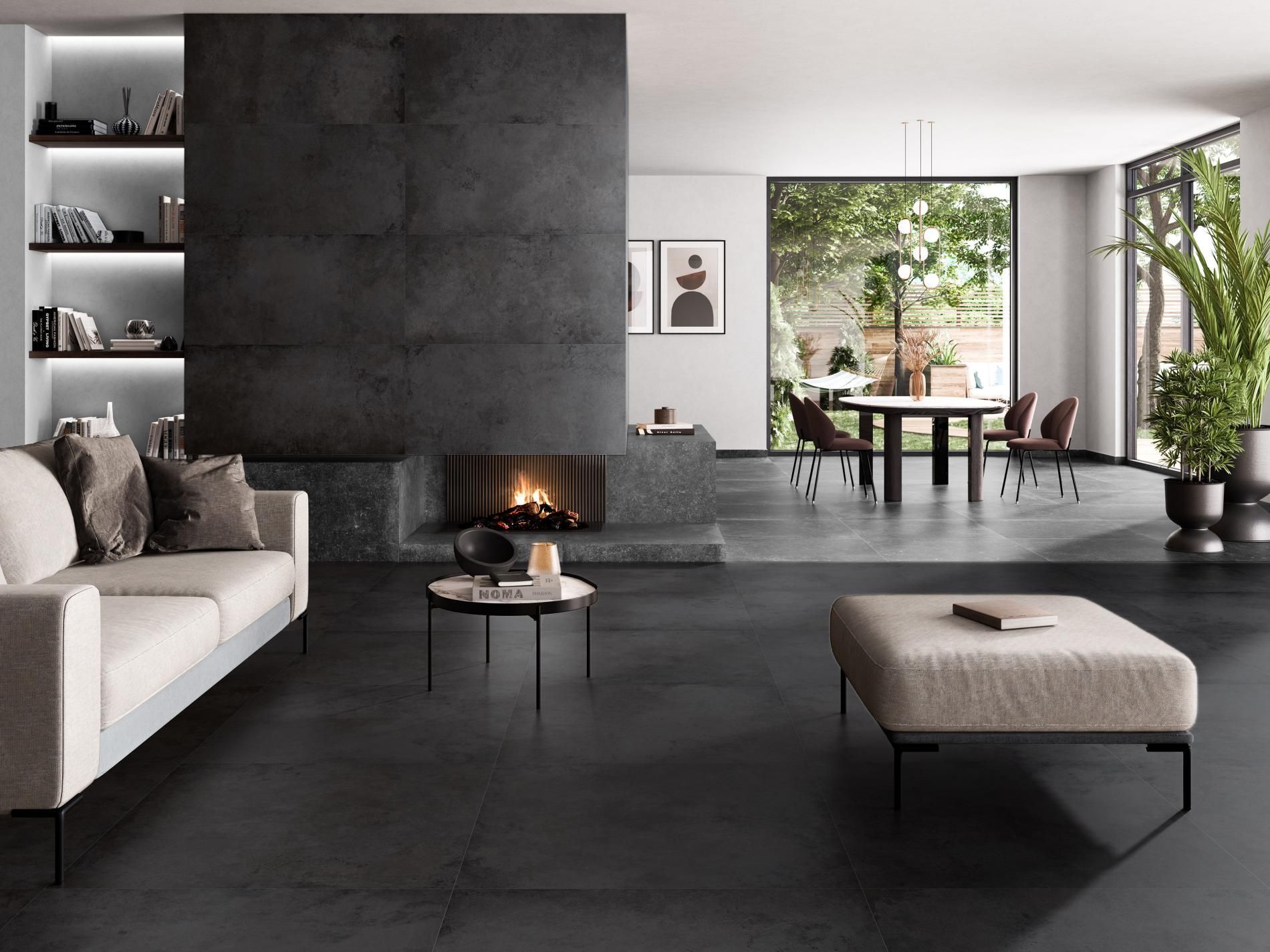 Black metallic floor and wall tiles used in a modern black themed living room feature a fireplace