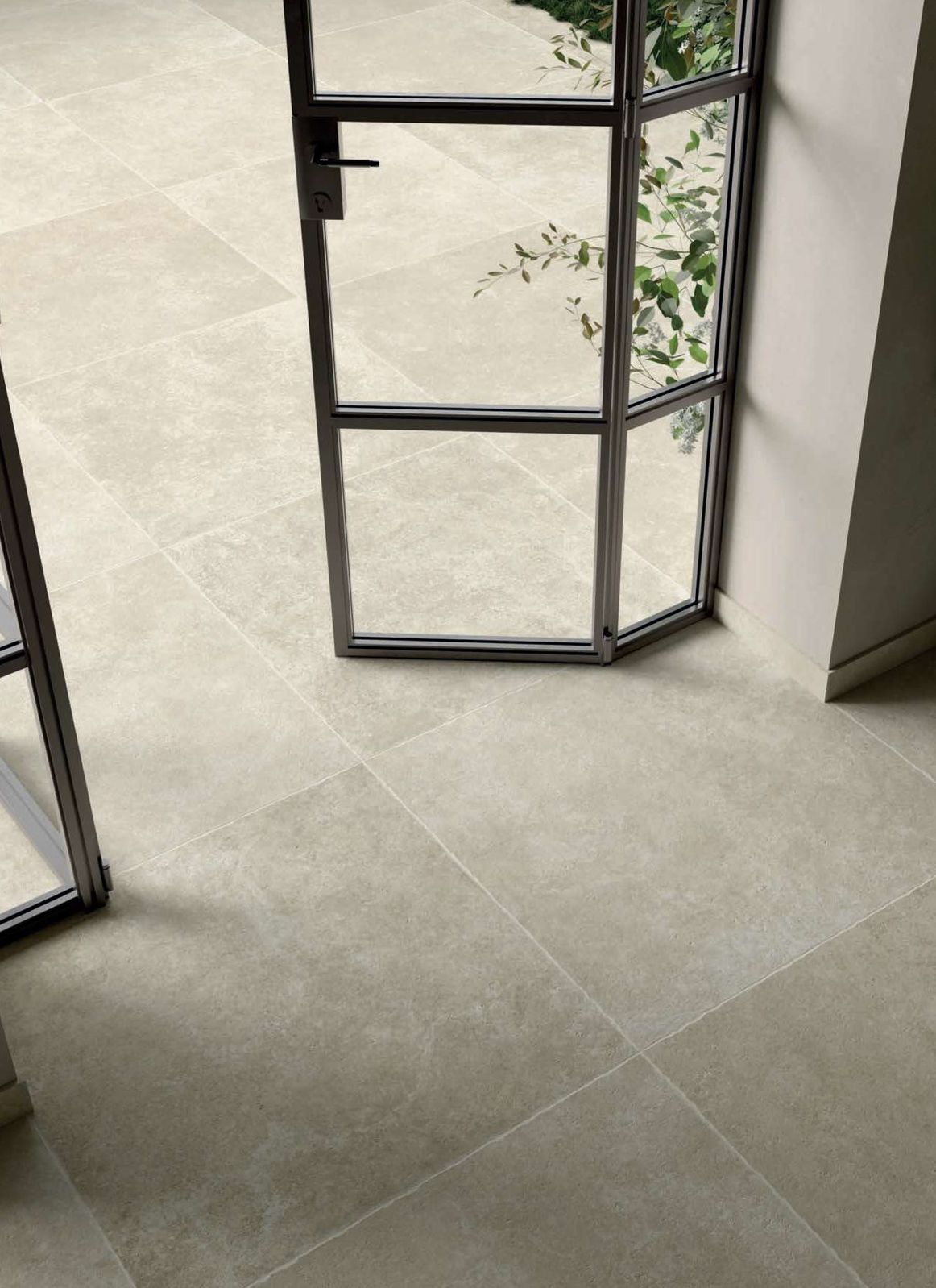 Limestone effect floor tile between walkways