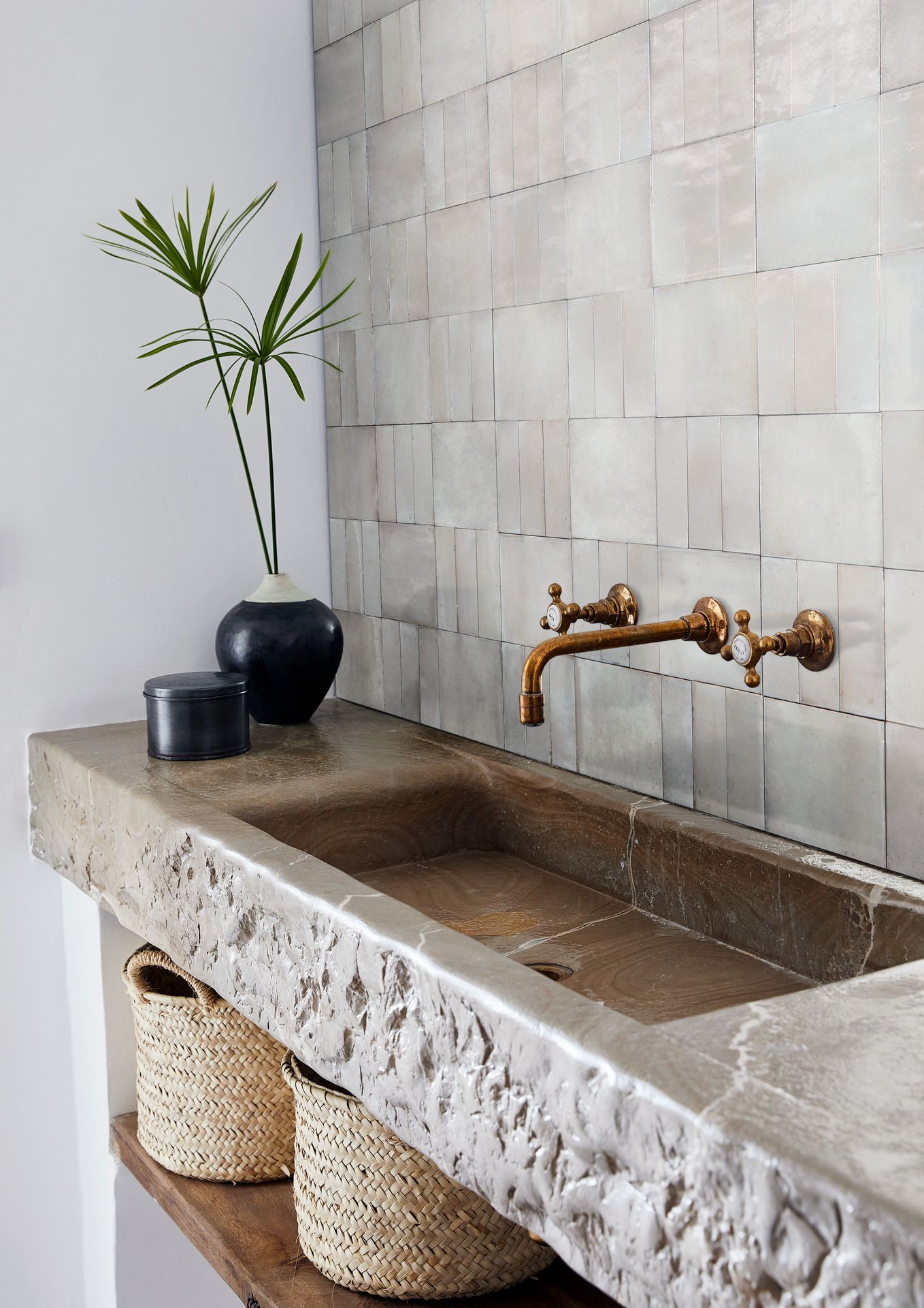 Bespoke marble effect sink and a white tiled splashback
