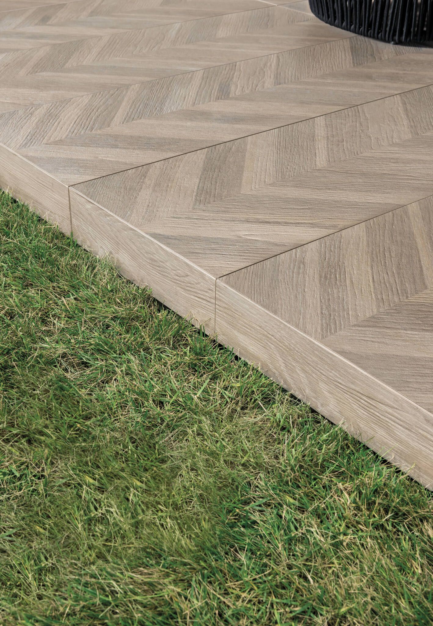 wood tile close up from outside next to grass